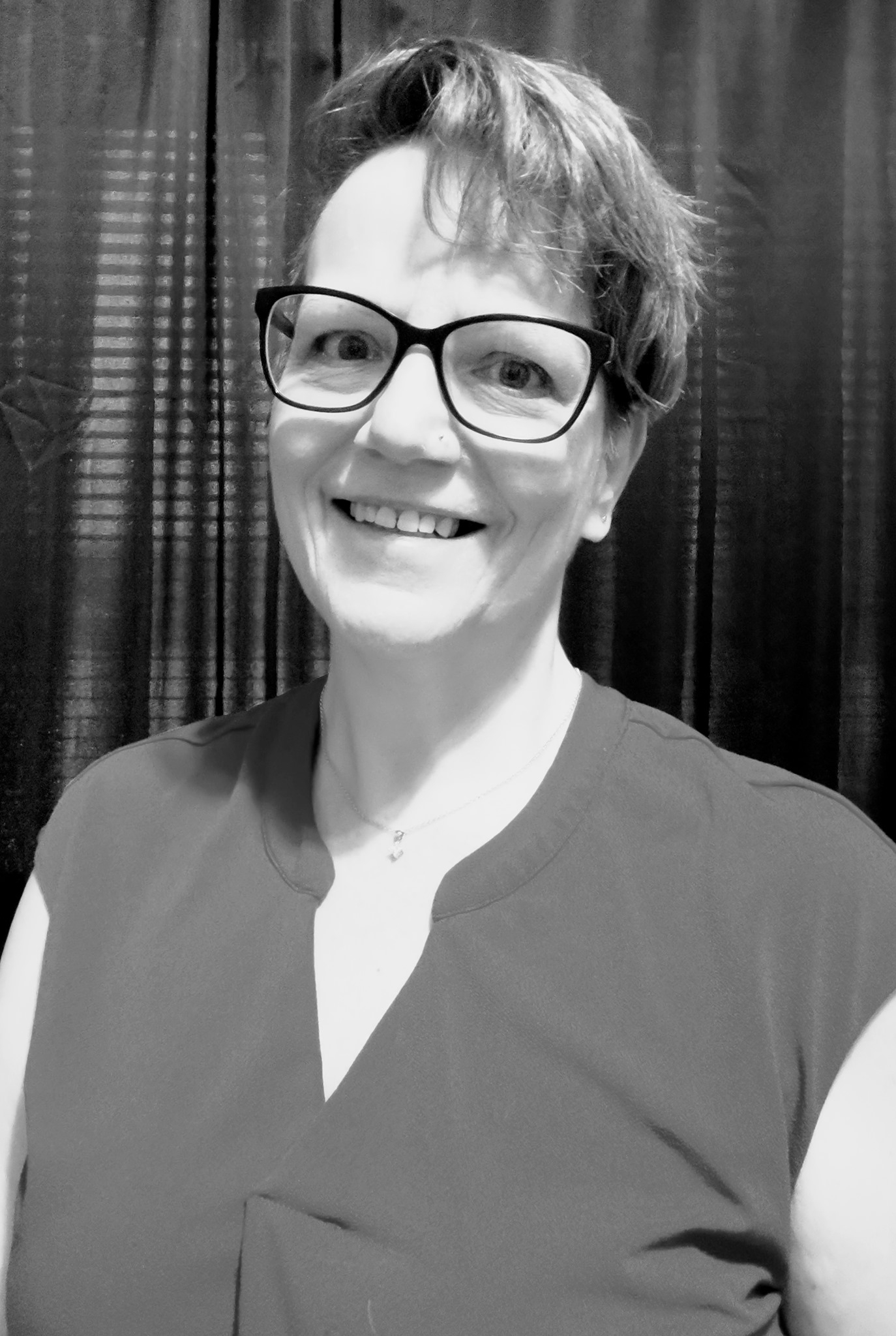 Serena Front Portrait 2025 short hair, glasses, blue top